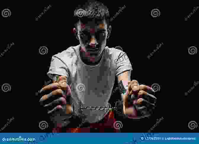 A Group Of Young Men In Prison Uniforms, Looking Sad And Hopeless. 17 And Under: Has The System Failed Our Youth?